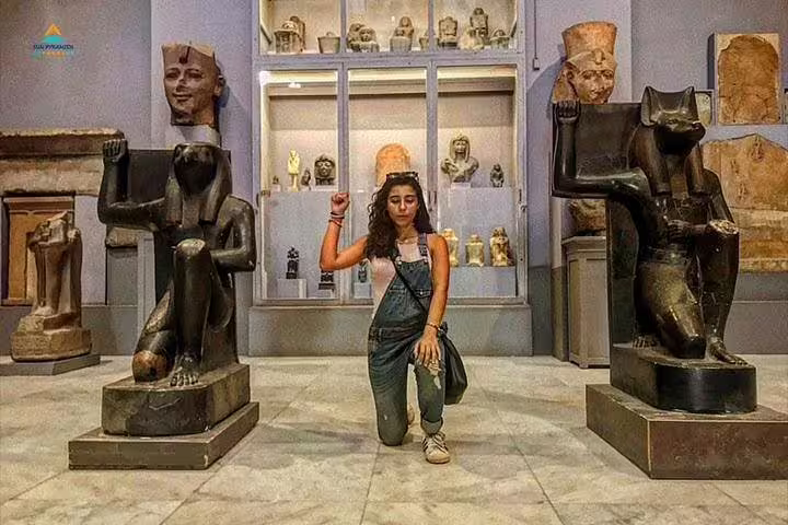 Traveler at Cairo Egyptian Museum with ancient statues on a 2-day Hurghada to Cairo and Luxor tour