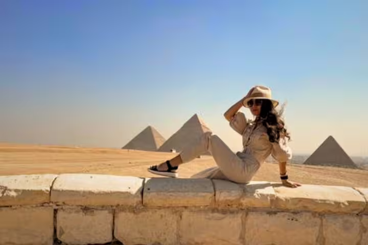 Traveler posing at the Giza Pyramids viewpoint on a shore excursion from Alexandria Port to Cairo and GEM