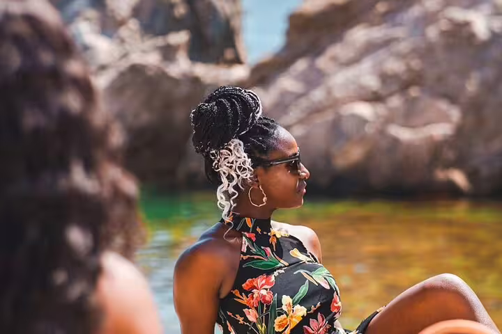 Traveler relaxing by crystal-clear Adriatic water near Dubrovnik on a private tour with local guide and stops