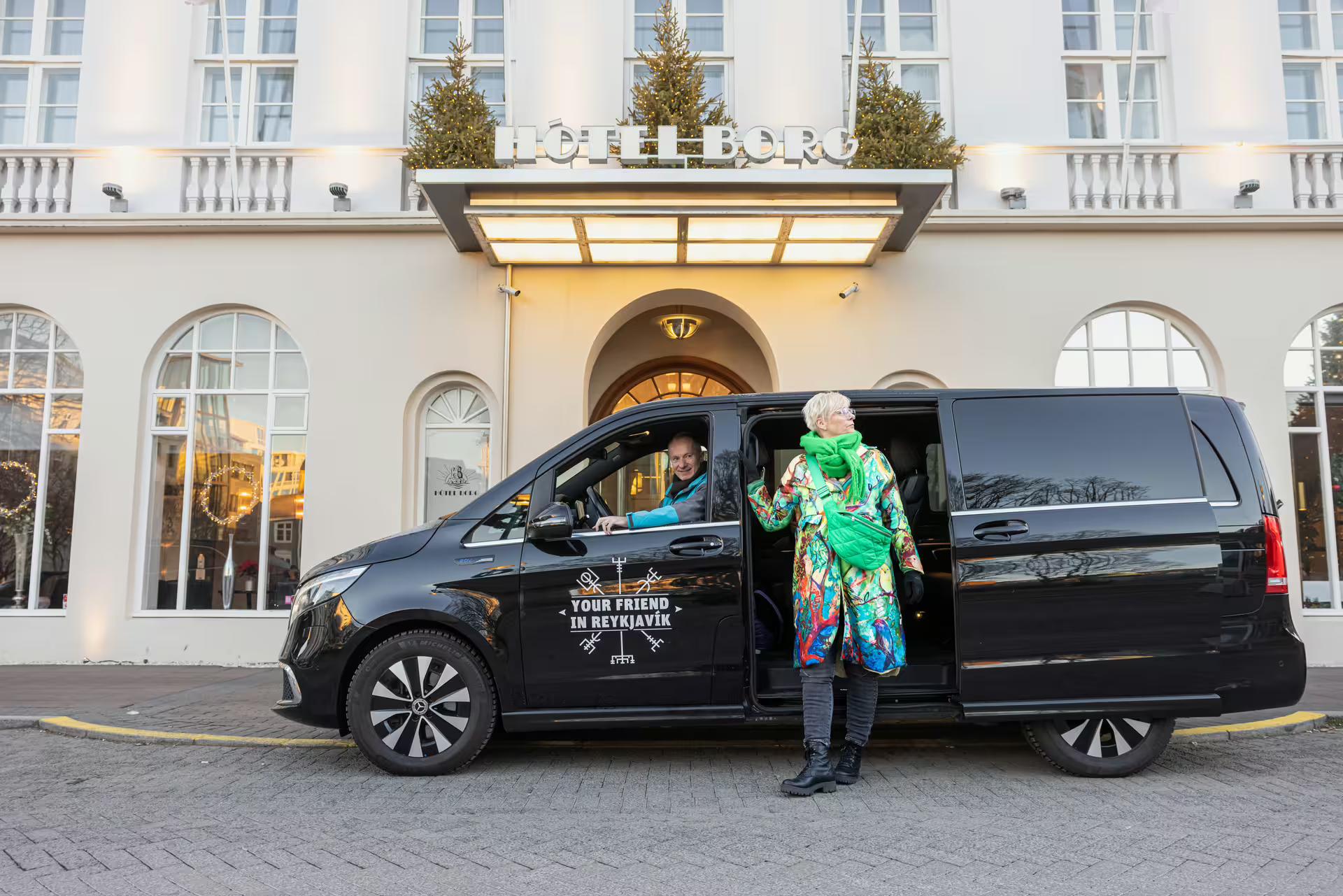 A traveller entering a tour vehicle from Your Friend in Reykjavik