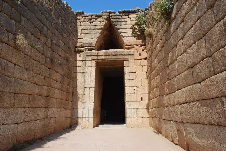 Close-up of the Treasury of Atreus beehive tomb entrance in Mycenae on a private day tour from Athens to Nafplio