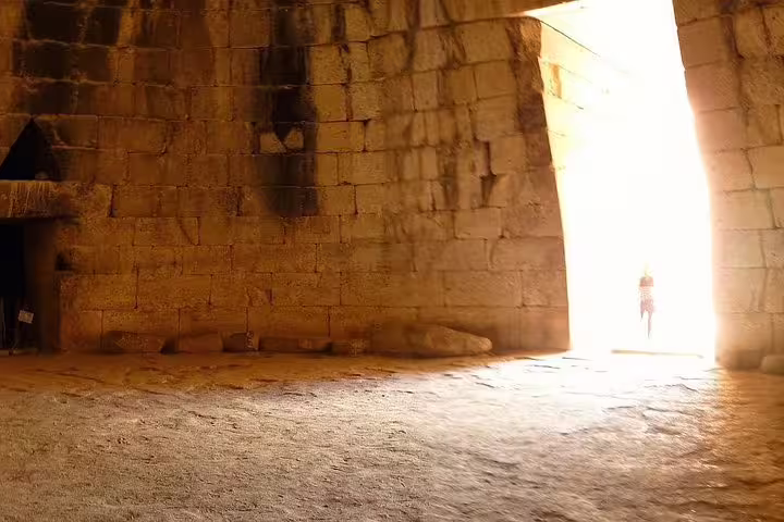 Sunlit entrance of the Treasury of Atreus tholos tomb in Mycenae on Epidaurus and Nafplio tour