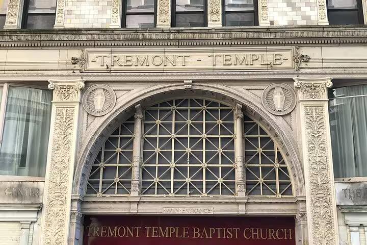 Ornate facade of Tremont Temple Baptist Church with arched window and decorative stonework in Boston