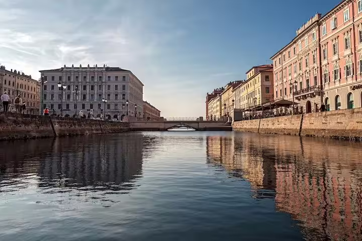 Canal Grande of Trieste lined with colorful neoclassical palaces and cafes, a highlight of the hidden gems guided walking tour