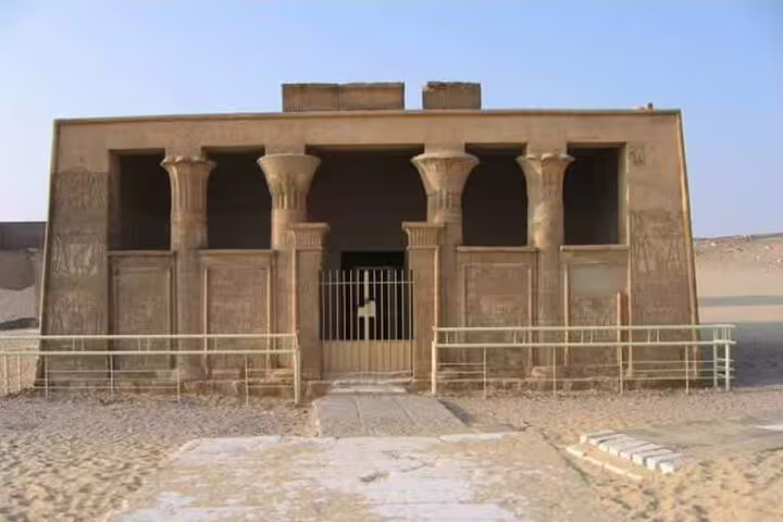 Ancient tomb facade with papyrus columns at Tuna el-Gebel, El Minya day tour from Cairo by car