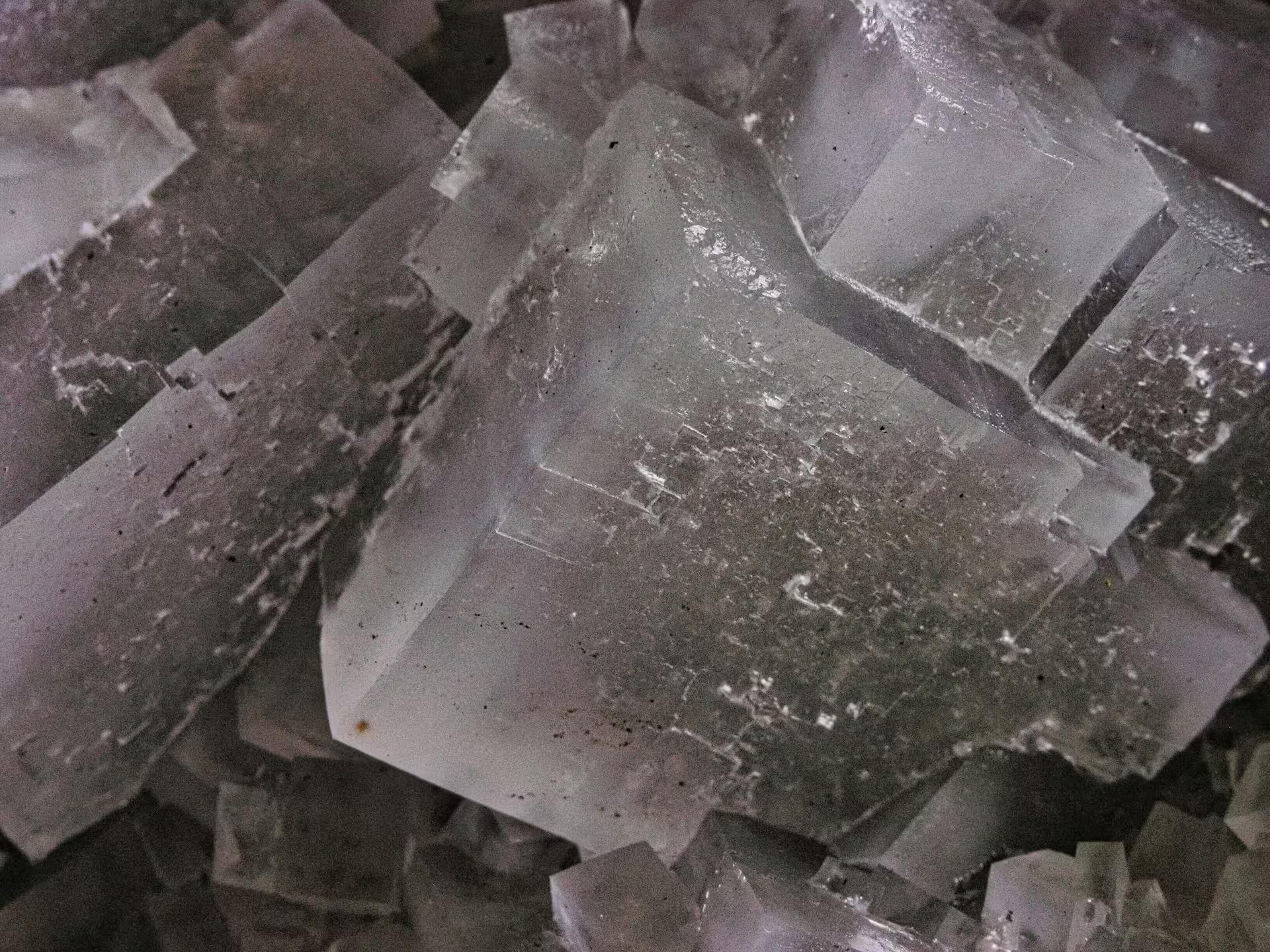 Close-up of ancient crystalline salt rock formations inside Turda Salt Mine on a guided tour from Cluj