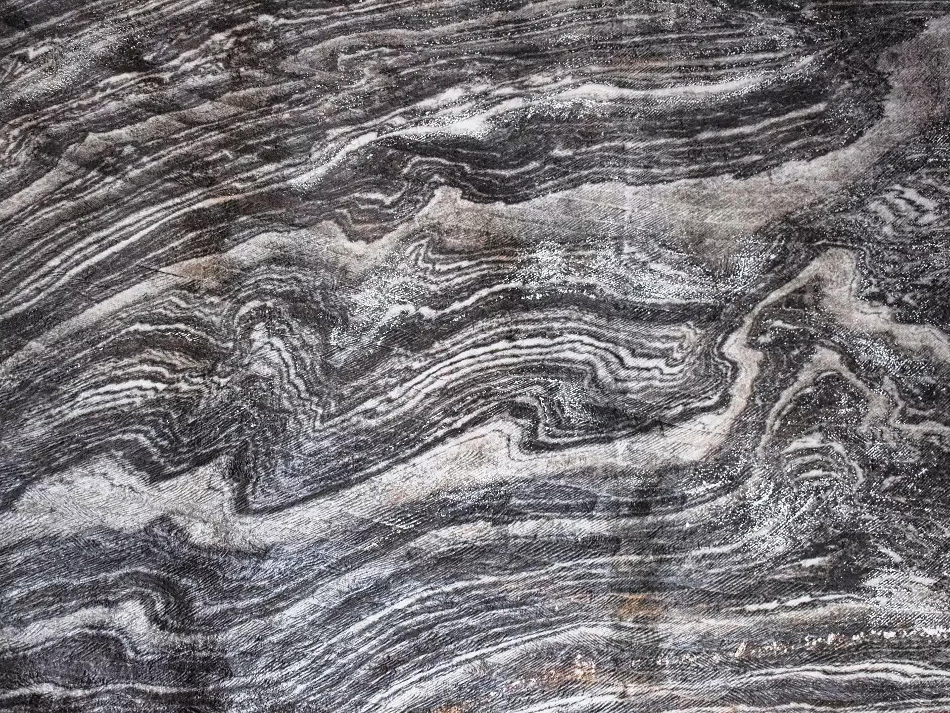 Close-up of ancient swirling salt rock layers on Turda Salt Mine walls revealing geological history on a Cluj guided tour