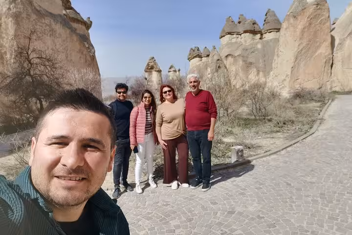 Private 6-day Turkey tour group photo in Cappadocia, walking among fairy chimneys near Göreme