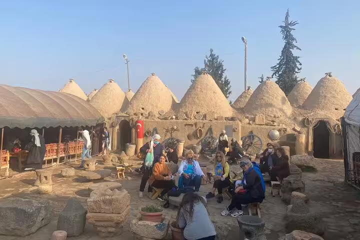 Travelers relax at traditional beehive houses in Harran, a cultural stop on a 10-day private Turkey tour