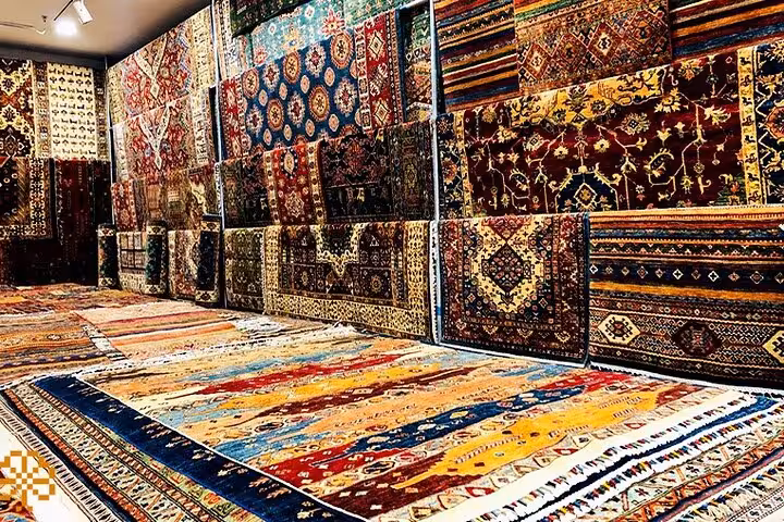 Colorful Turkish carpets in a Cappadocia rug shop, part of a guided shopping tour for local crafts