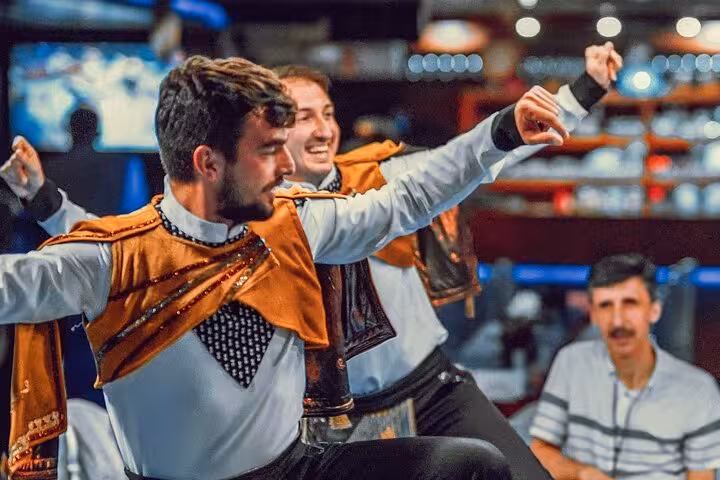 Traditional Turkish folk dancers performing onboard New Year's Eve party cruise in Istanbul with live show