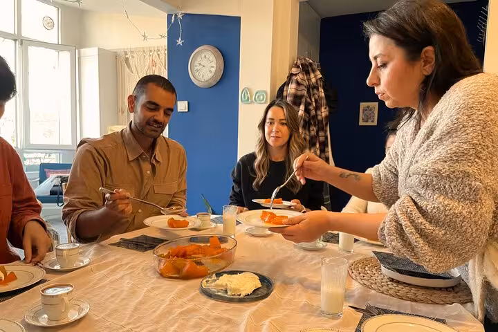 Guests share homemade Turkish dishes at a local home cooking experience in İstanbul city center