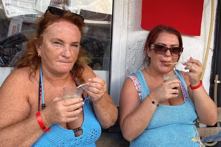 Two women savoring traditional Turkish drinks, capturing the essence of local culture and hospitality.