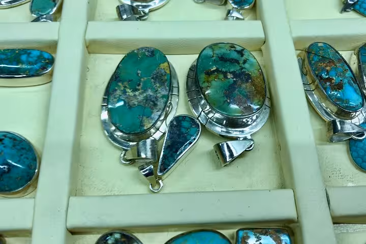 Turquoise gemstone pendants in a Cappadocia jewelry shop, popular stop on the Best of Cappadocia shopping tour