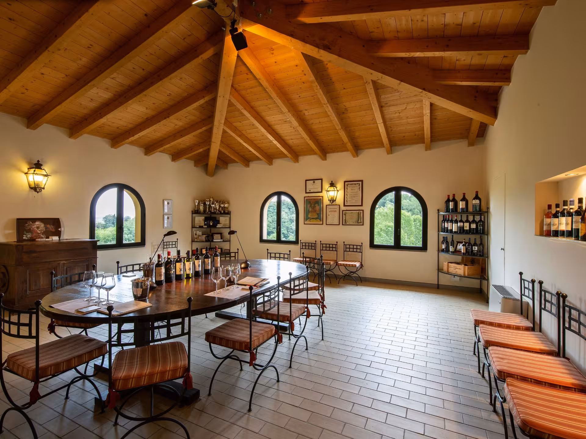 Charming Tuscan wine tasting room with rustic decor and panoramic views near Pisa, ideal for an authentic experience.