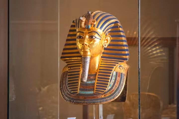 Golden Tutankhamun funerary mask display at the Grand Egyptian Museum, part of Giza Pyramids and lunch tour