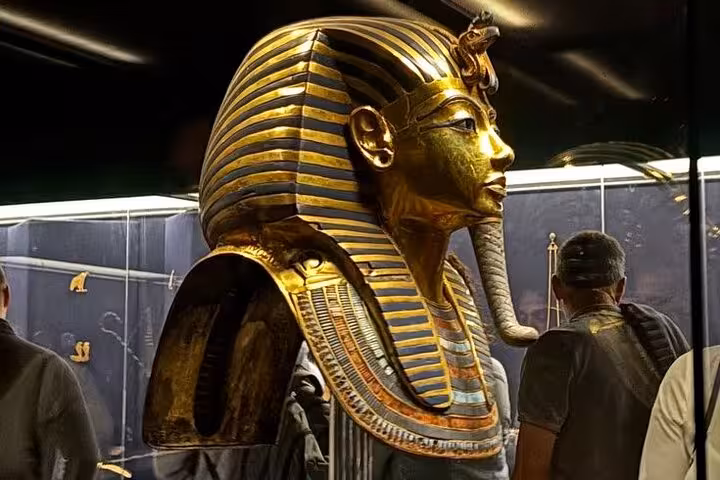 Tutankhamun golden mask exhibit at the Grand Egyptian Museum on Hurghada small-group Cairo and Pyramids tour