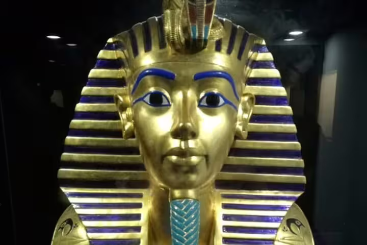 Golden Tutankhamun mask replica display at Pharaonic Village Cairo, highlight of a private tour in Egypt
