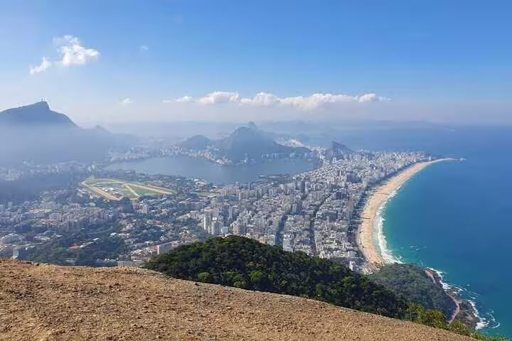 Stunning panoramic view of Rio de Janeiro from Two Brothers Hill, showcasing beaches and urban landscape.