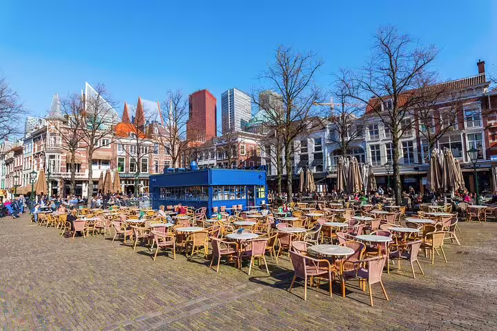 Utrecht city center square with outdoor cafe terraces and skyline, stop on a self-guided GPS highlights tour