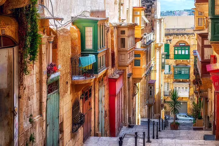 Colorful Valletta street with traditional Maltese balconies on a half-day sightseeing tour with a local guide