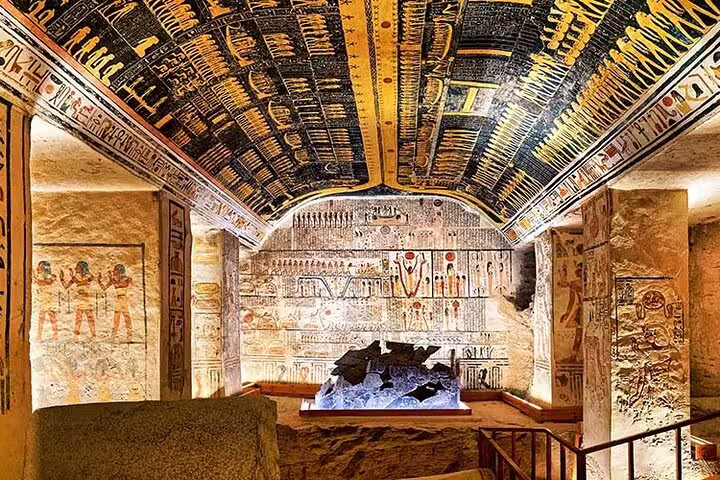 Valley of the Kings tomb chamber in Luxor with painted hieroglyphs on ceiling, day tour from Hurghada by bus