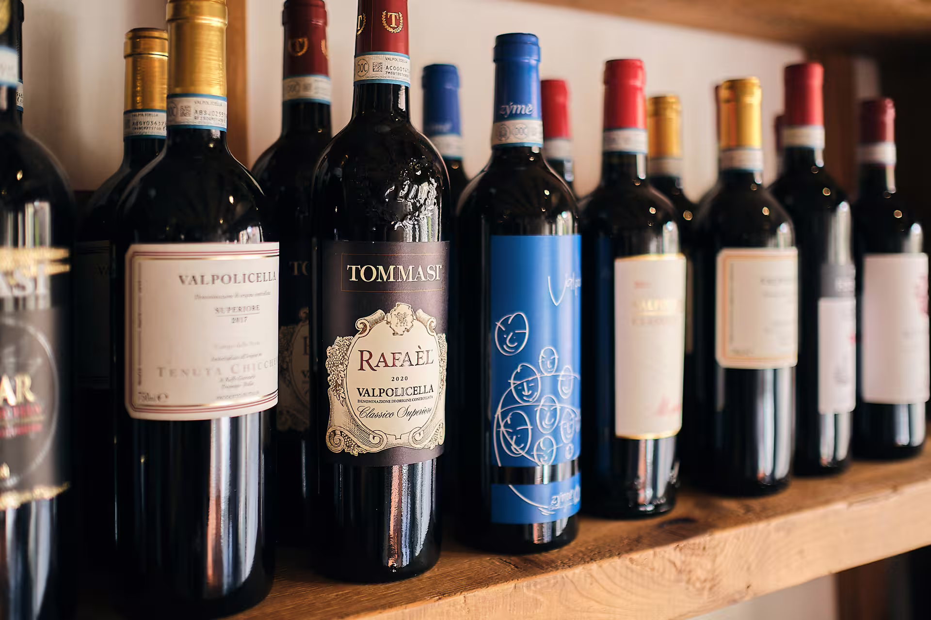 Valpolicella wine bottles on shelf for Verona wine tasting tour near Juliet’s House in the historic center