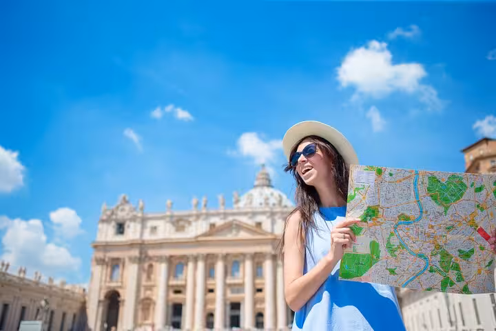 Visitor with map in St Peter’s Square before Vatican Museums skip-the-line hosted entry with official audio guide