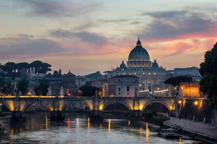 Sunset view of St Peter’s Basilica and Tiber River near Vatican City, ideal for Vatican Museums and Sistine Chapel tour