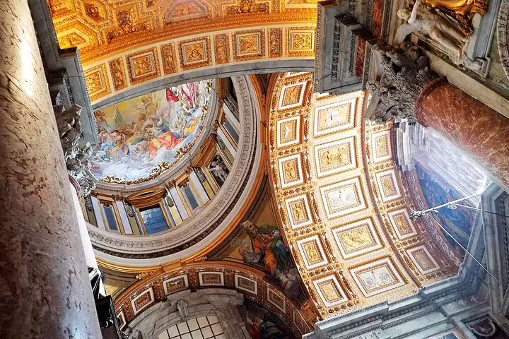 Golden vaulted ceilings and detailed frescoes inside St Peter’s Basilica on an exclusive Vatican Museums and Sistine Chapel tour