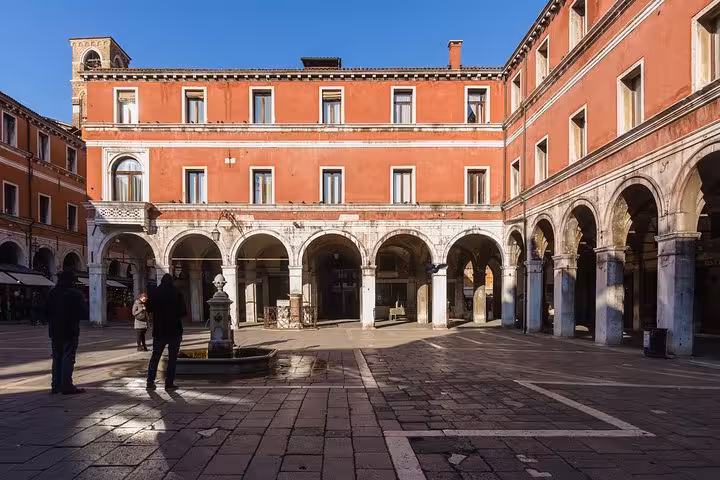 Explore Venice's historic architecture in sunlit squares on our guided tour with romantic gondola ride.