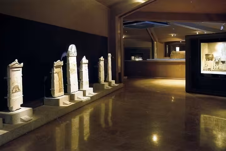 Vergina museum gallery with ancient Macedonian stelae, stop on Alexander the Great private tour from Athens