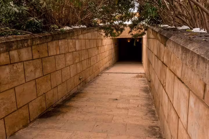 Stone corridor entrance to Vergina Royal Tombs museum on Athens to Meteora and Vergina full-day tour with dinner