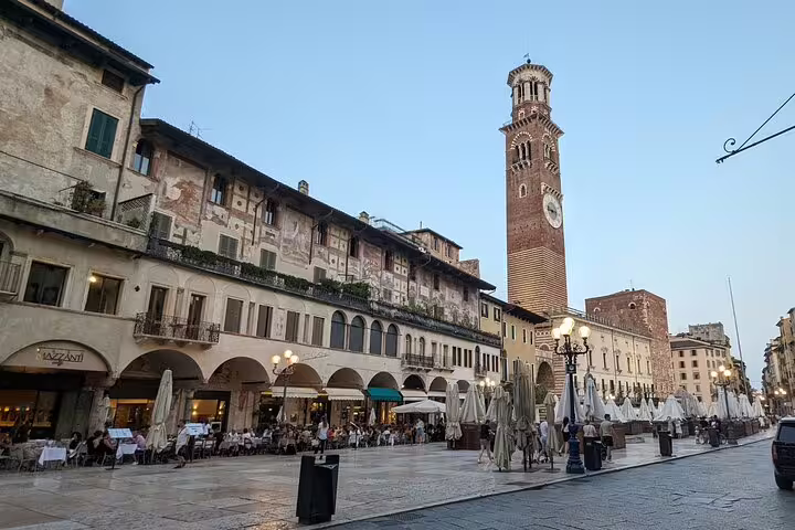 Piazza delle Erbe and Torre dei Lamberti in Verona, key stop on a guided walking tour of landmarks