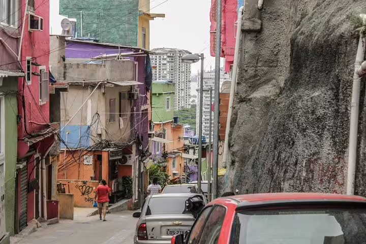 Colorful houses and narrow streets in Vidigal Favela, showcasing vibrant urban life and culture.