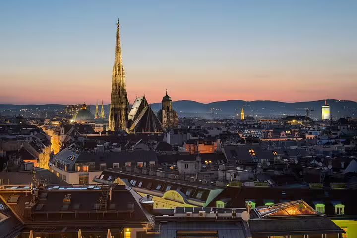 Twilight view of Vienna's skyline featuring St. Stephen's Cathedral, ideal for a private night sightseeing tour.
