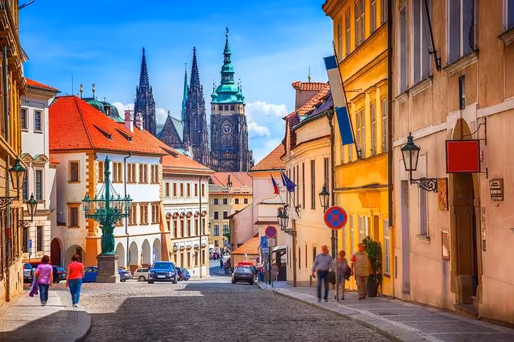 Historic Prague street with castle spires, part of Vienna to Prague private transfer with Cesky Krumlov stopover