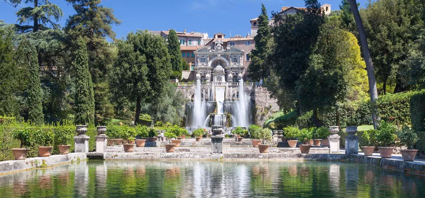 Discover Villa d'Este's majestic gardens in Tivoli featuring grand fountains and lush greenery.