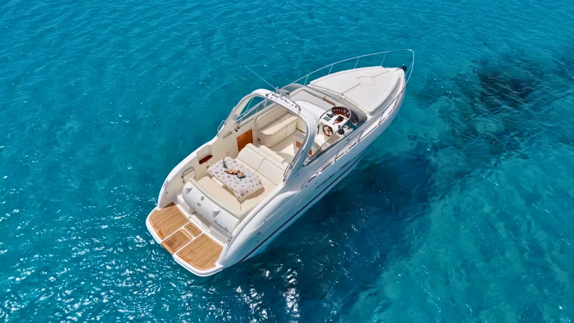 Luxurious speedboat in Villasimius with elegant seating, ready for an exclusive Sardinian sea adventure.