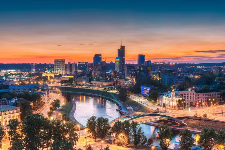 Vilnius city center at sunset over the Neris River and bridges, a highlight on the self-guided scavenger hunt