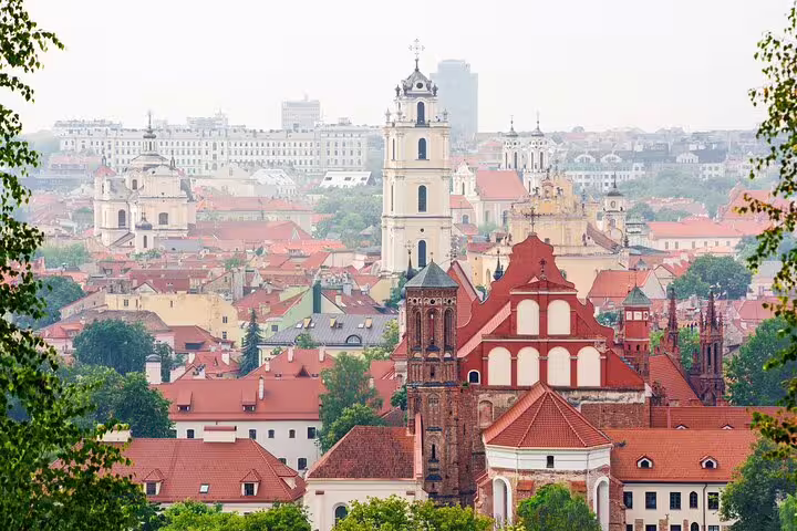 Vilnius Old Town skyline with red rooftops and church towers, ideal for a self-guided scavenger hunt tour