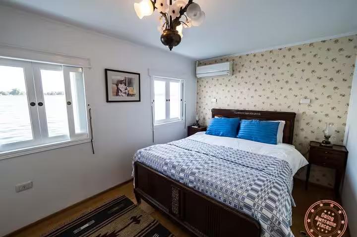 Private cabin bedroom on VIP dahabiya Nile cruise Luxor to Aswan 4 nights 5 days, river-view windows and AC