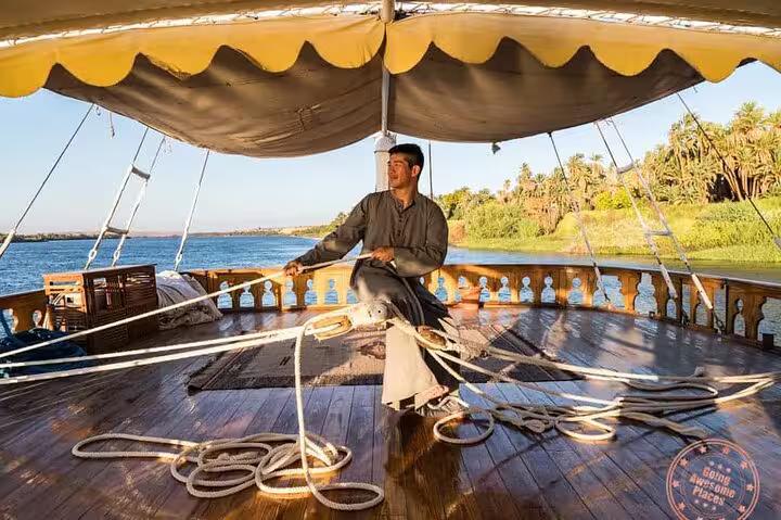 Sailor handling ropes on VIP Dahabiya deck during Nile cruise from Luxor to Aswan, 4 nights 5 days