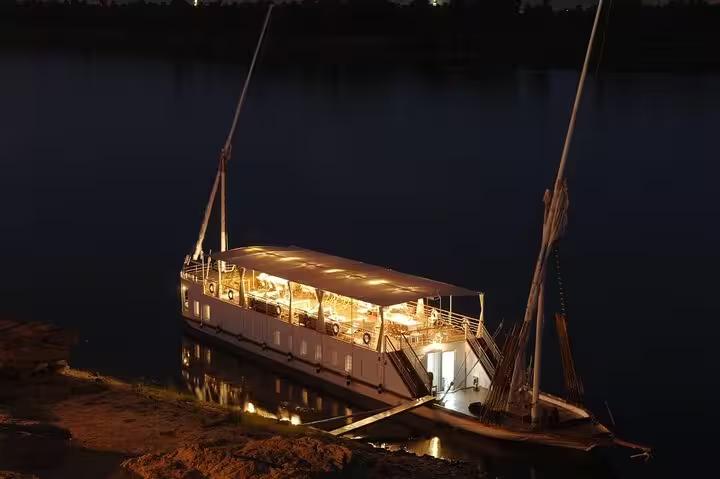Illuminated VIP Dahabiya at night on the Nile, luxury 4-night cruise from Luxor to Aswan, Egypt