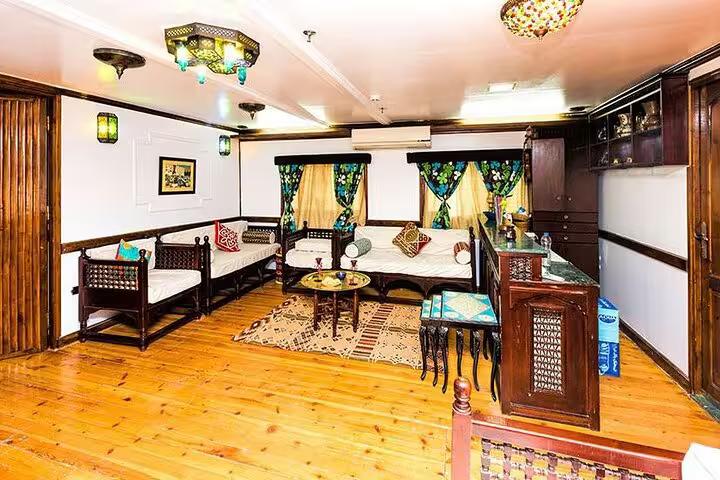 Elegant lounge and bar on VIP Dahabiya Nile cruise from Luxor to Aswan, 4 nights 5 days with seating