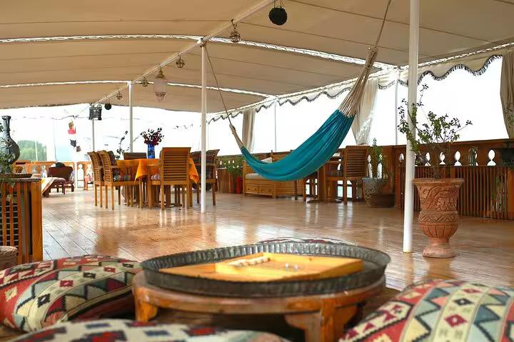 VIP Dahabiya Nile cruise sun deck lounge with dining area and hammock, Luxor to Aswan 4 nights