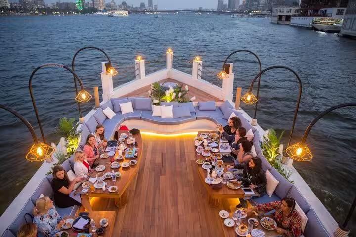 Sunset dining on VIP dahabiya Nile cruise deck, Luxor to Aswan 4 nights 5 days with gourmet dinner
