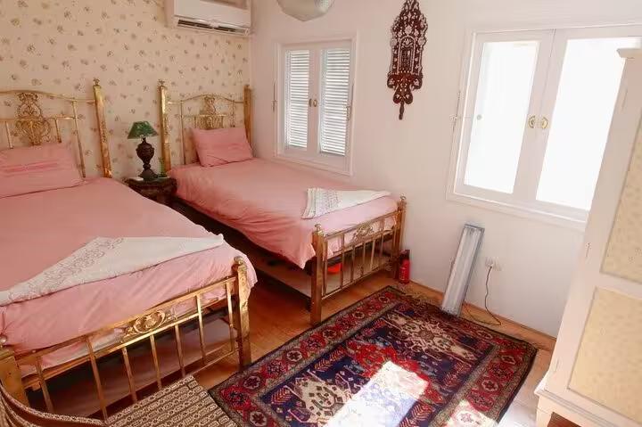 Twin cabin with brass beds on VIP Dahabiya Nile cruise from Luxor to Aswan, 4 nights 5 days tour