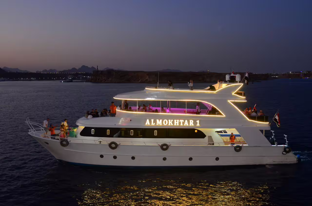 Illuminated VIP yacht cruising the Red Sea at dusk in Sharm El Sheikh, perfect for a dinner cruise by boat