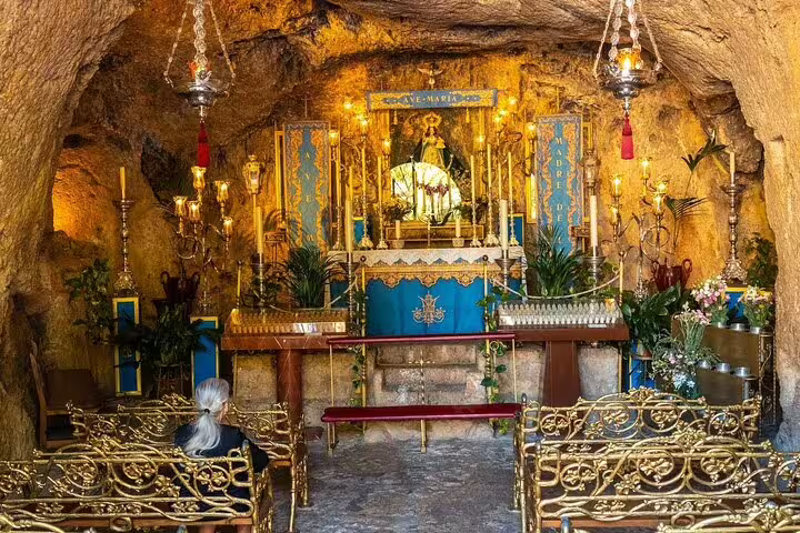 Intricately designed altar inside the Virgen de la Peña chapel cave, a hidden gem on the Mijas guided tour.